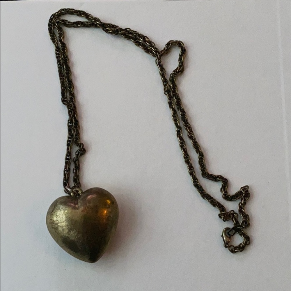 Gold heart necklace.